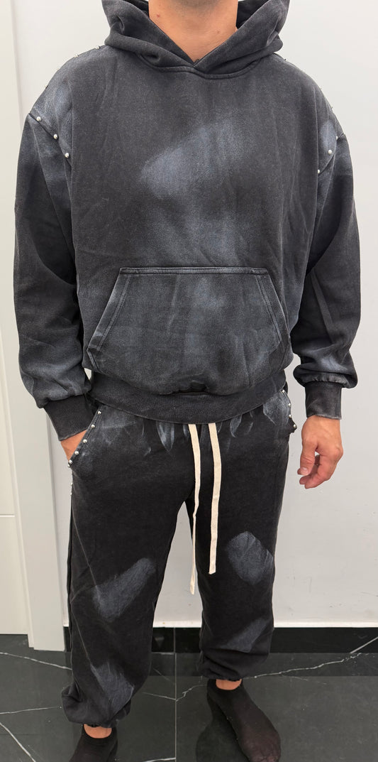 Conjunto chandal desgastado tachuela